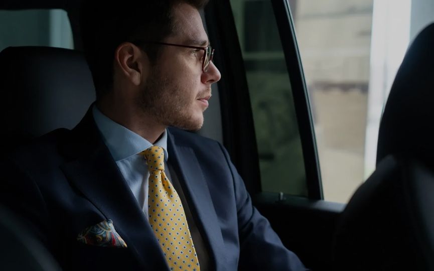 Passenger relaxing inside a luxury limo