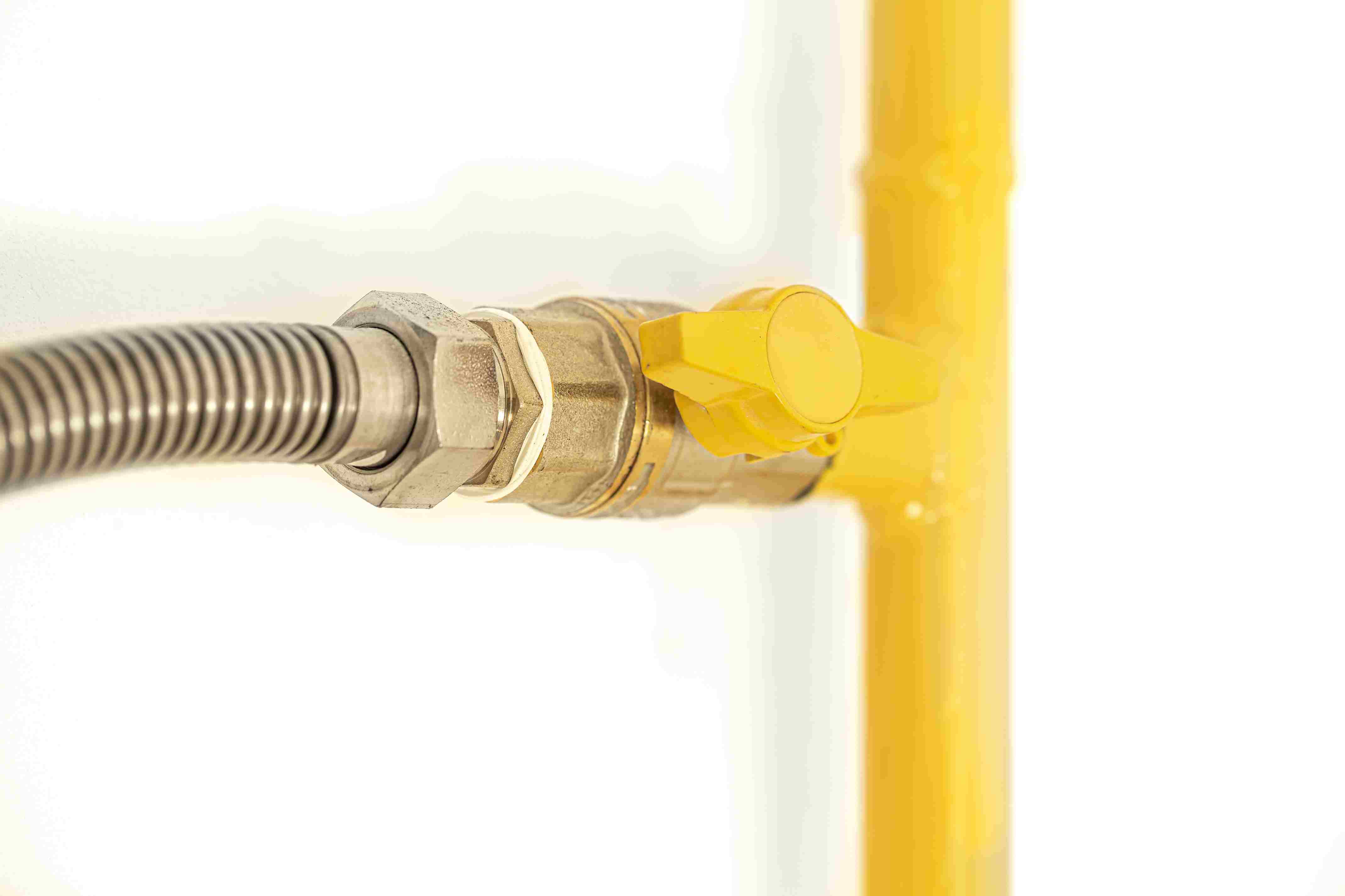 yellow-gas-pipe-with-a-valve-white-background