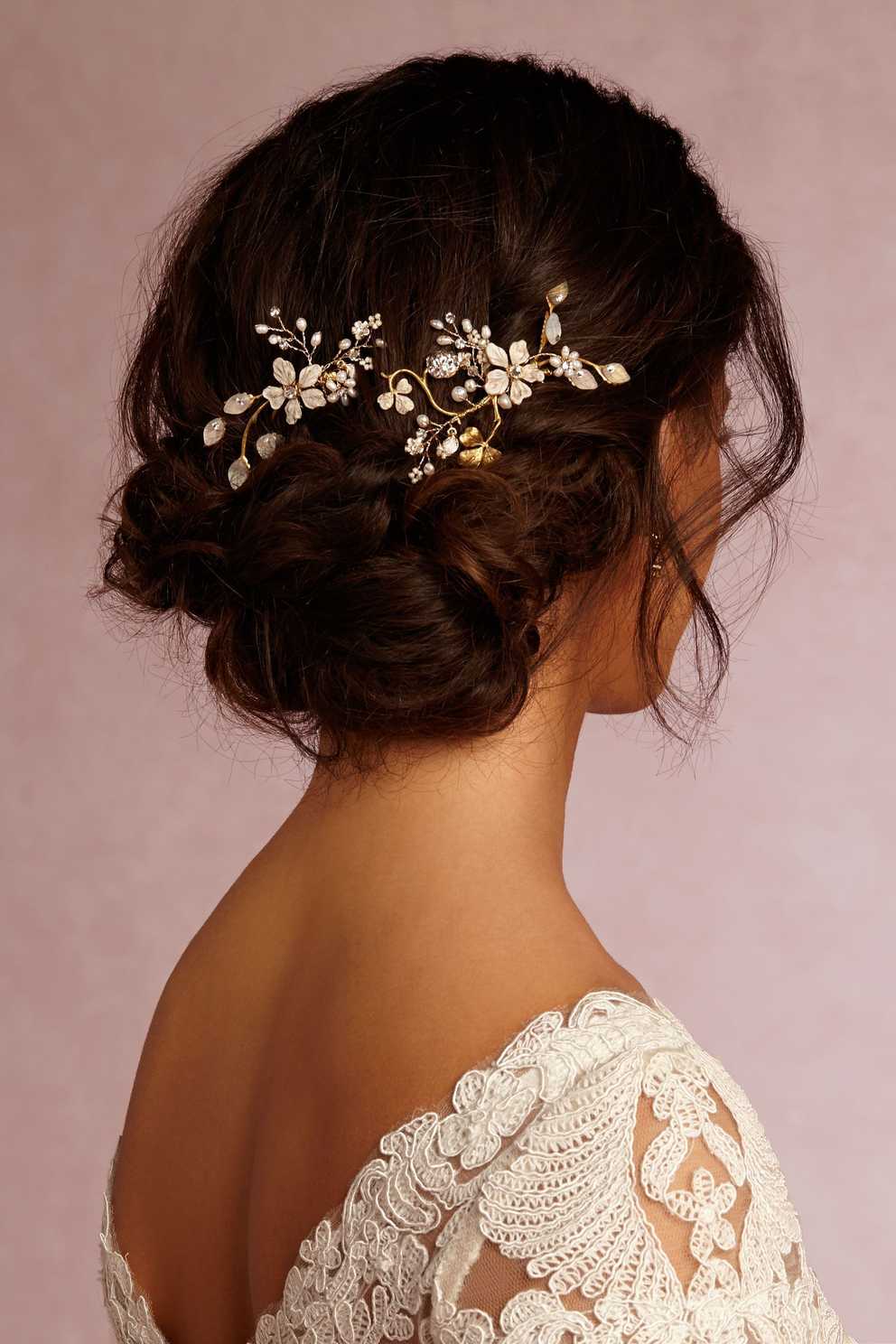 Featured Photo of Wavy Low Bun Bridal Hairstyles With Hair Accessory