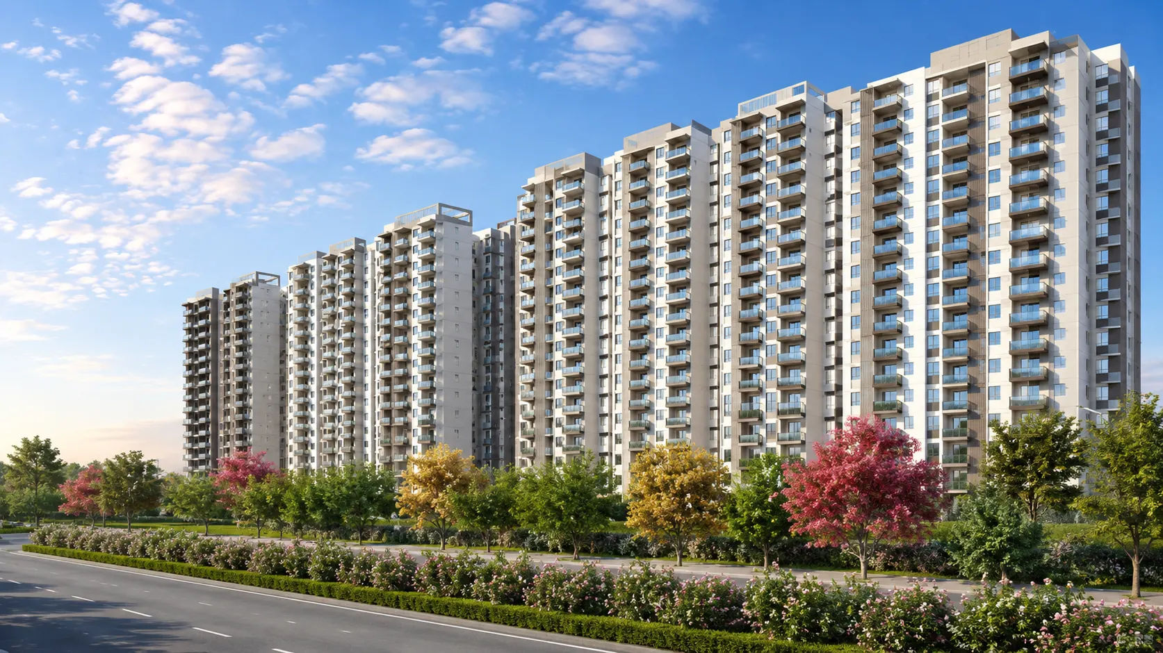 L&T Thanisandra Row of residential high-rise towers behind colorful landscaped trees and road
