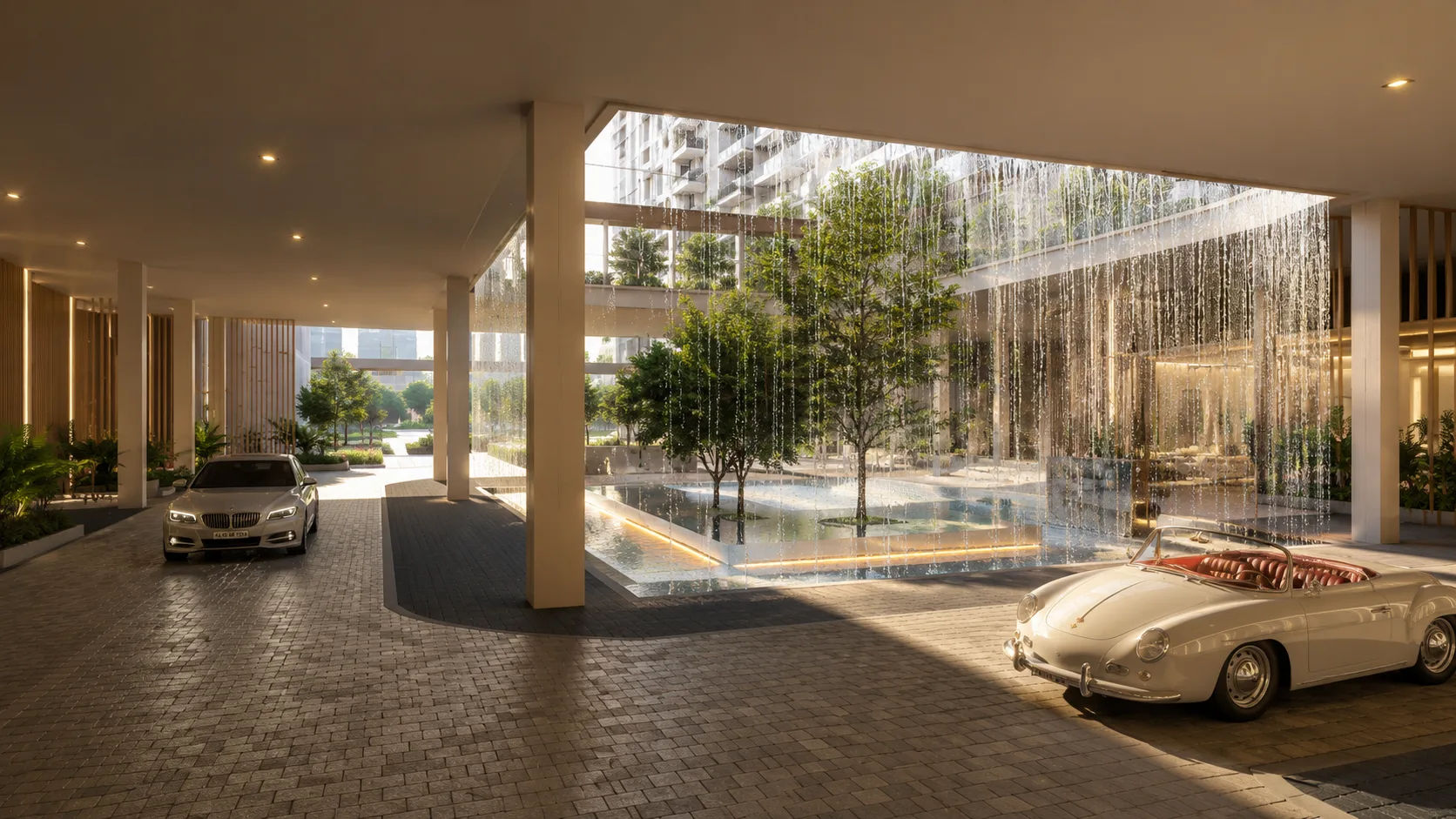 L&T Thanisandra Luxury apartment entrance drop-off area with central fountain and waterfall curtain