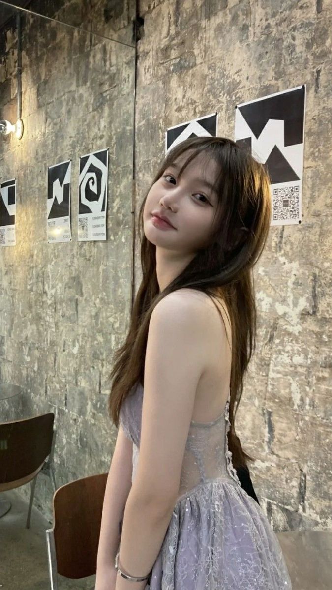 May include: Close-up of a pinball machine with a gold-colored slot machine feature. The text "SHOOT HERE TO LOAD GUMBALL" is visible. The machine has a blue and yellow design with silver metal rods.