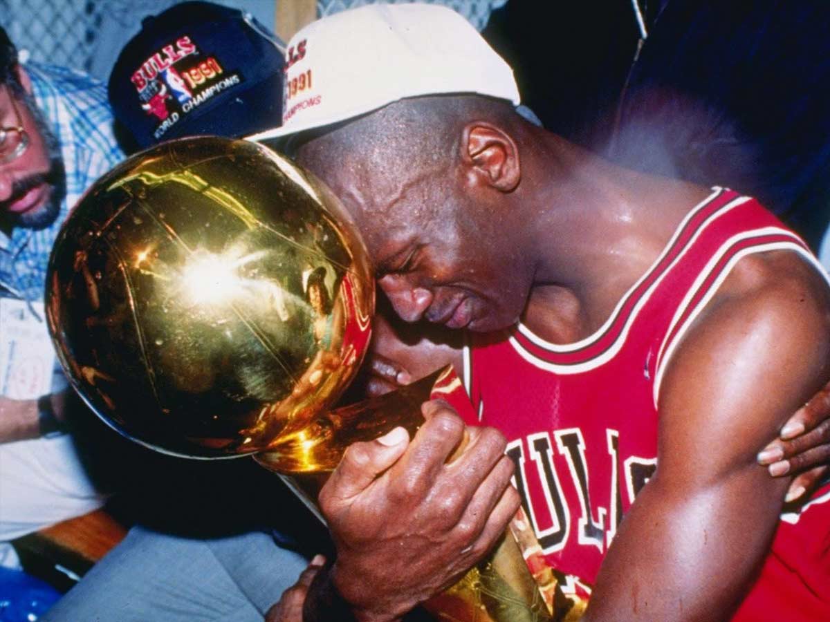 Michael Jordan receives his first title 