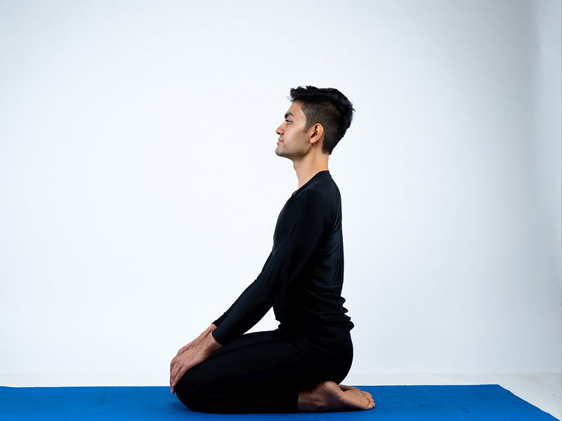 Stretch your legs forward to begin Dandasana. As you raise your arms into the air, maintain a straight back. Breathe out and let go of the contents of your stomach as you lean forward at the hips and place your upper body on your lower body. Put your fingertips on your big toes and lower your arms. Squeeze your nose as close to your knees as you can.
