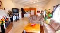 Rosemont Duplex w/ Sunset & Ocean Views - spacious living room with flat screen TV and fireplace