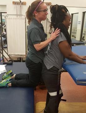 Amber D Campbell receives activity-based rehabilitation for her catastrophic illness