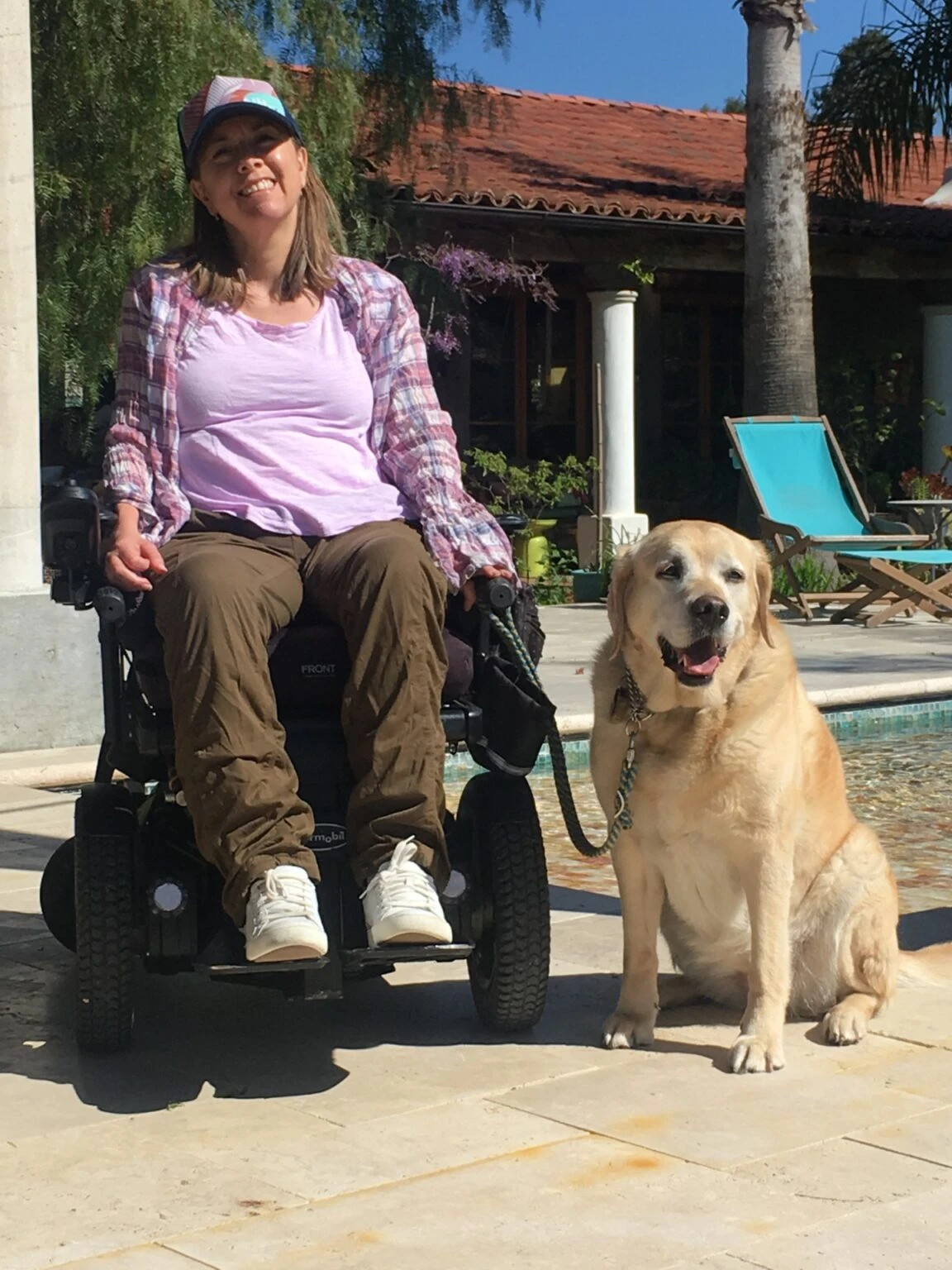 at the pool with her dog