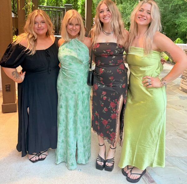 Pamela Lamb with 3 other blonde women in formal attire.