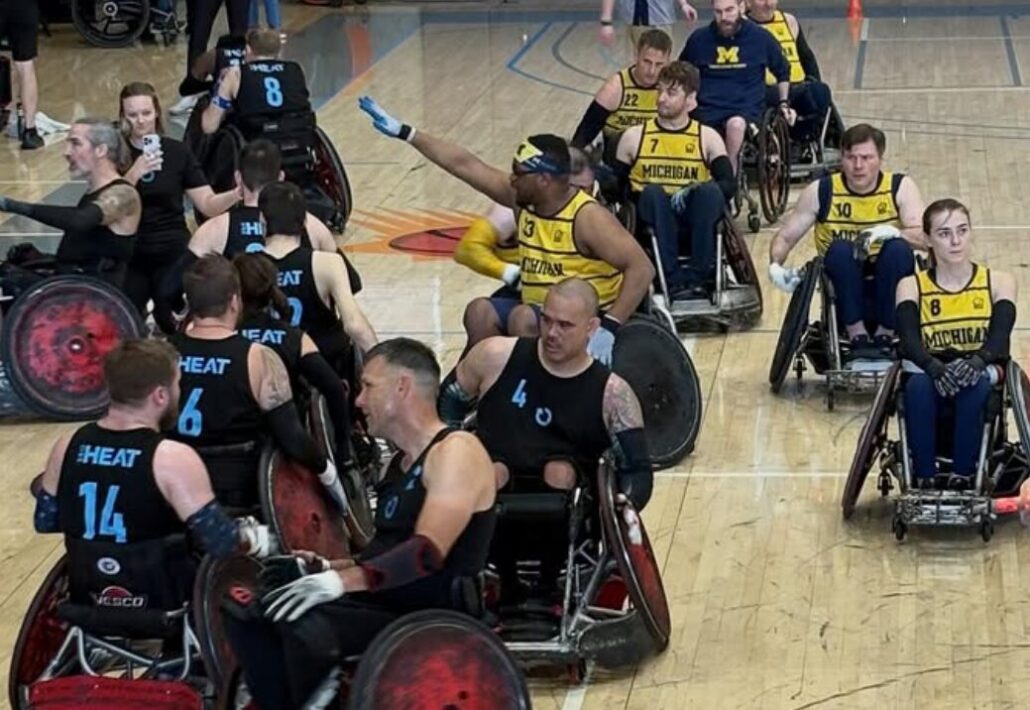 Andy Zimmer from Help Hope Live in his wheelchair playing rugby with 10 other players in 2026.