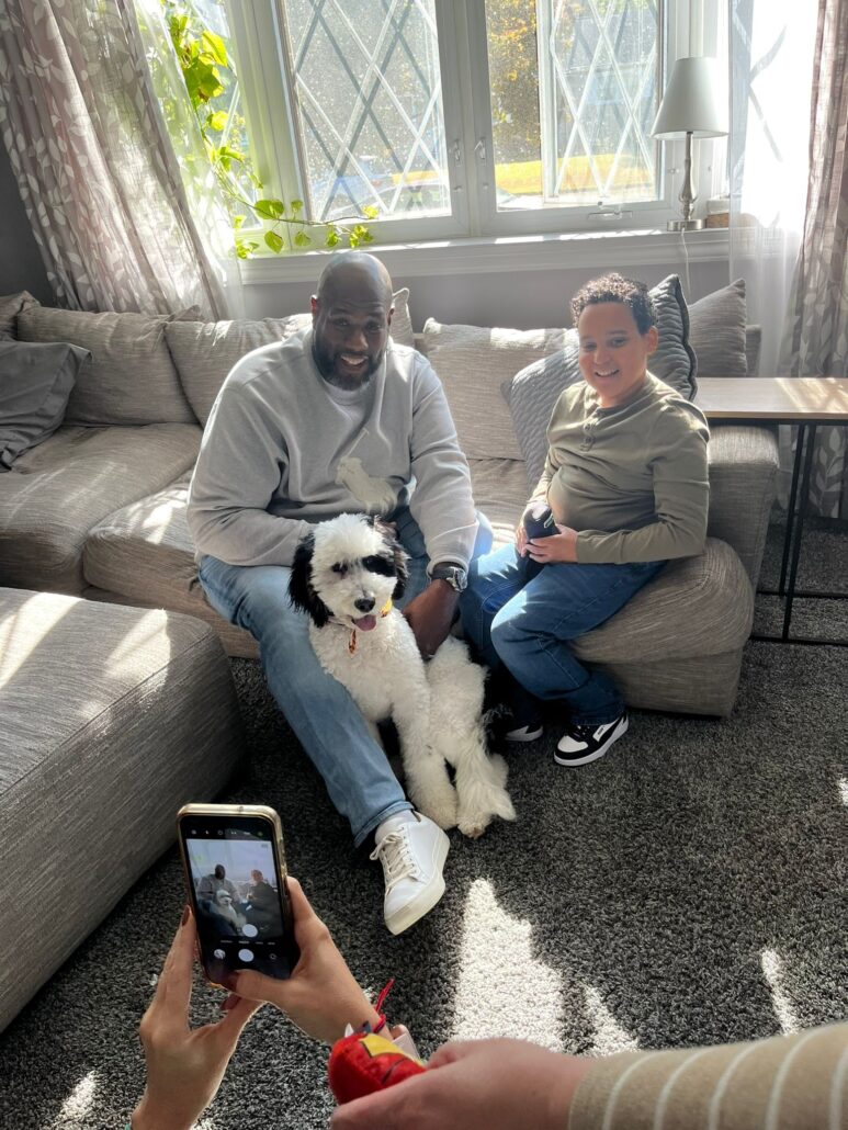 Barrett Brooks with Kelson Williams at their home with dog Gus.