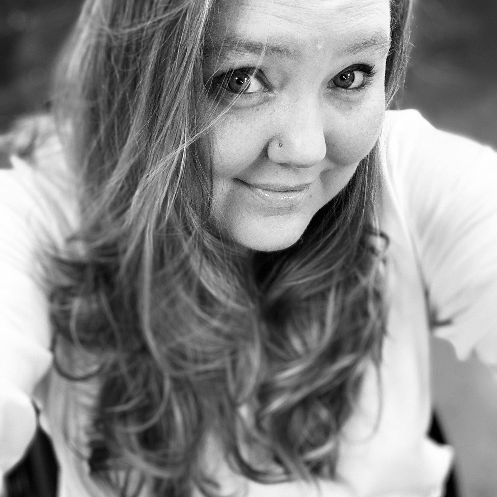 Black-and-white portrait of Help Hope Live client Jamie Carlson aka the "Cerebral Palsy Quilter."