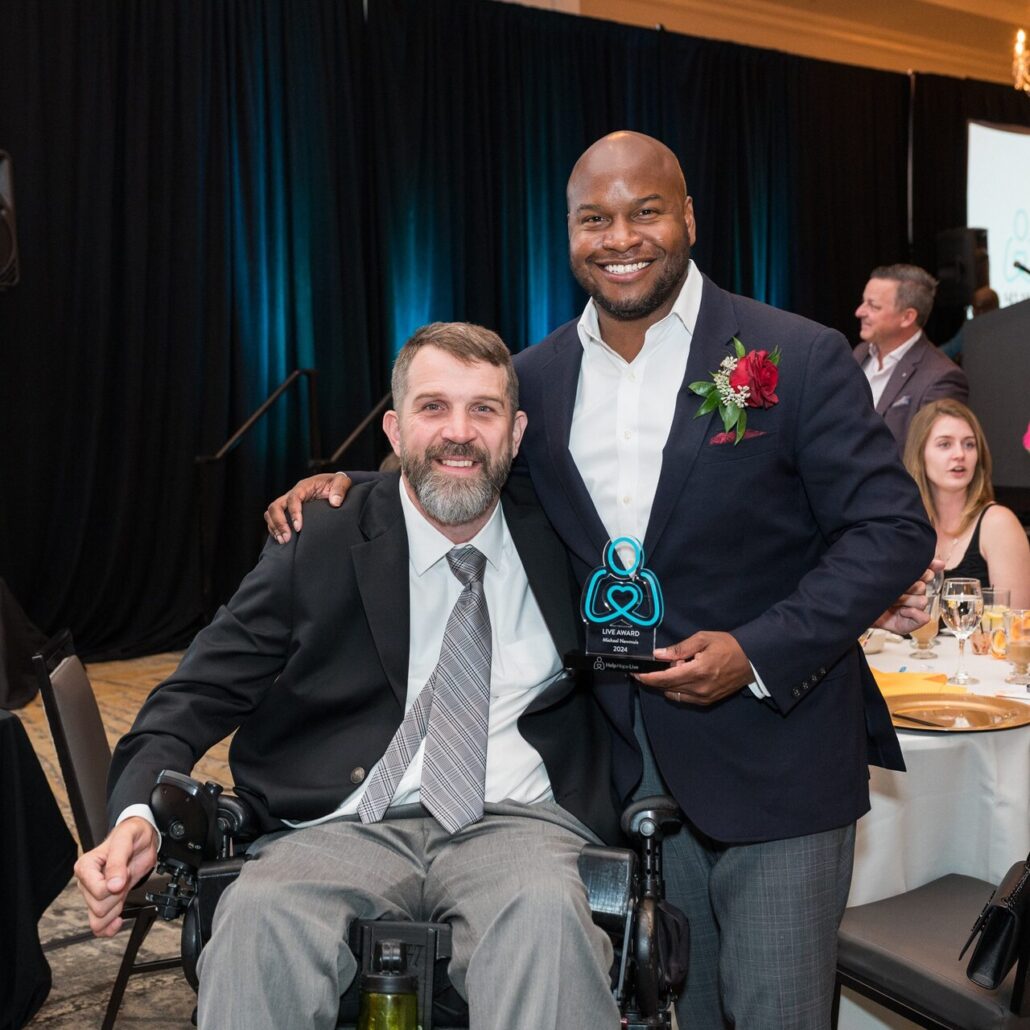 Michael Newmuis with his Live Award and Jeff Harris in his power chair formally dressed at the 2024 Live It Up! gala supporting Help Hope Live.
