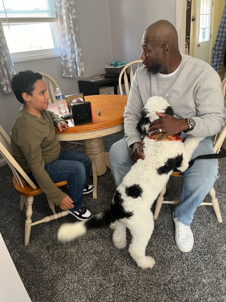 Barrett Brooks speaks to Kelson Williams at his family's home.
