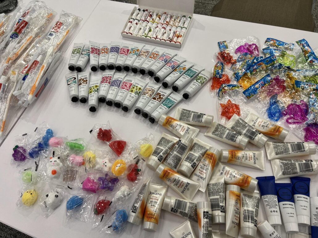 Bags of Hope packing items, including toys and lotions.