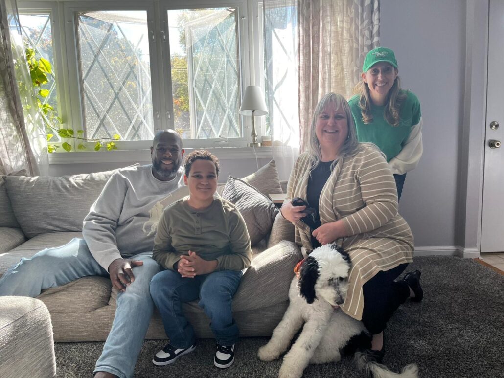 Barrett Brooks with Kelson Williams and family at their home with Brooke Schostak from Help Hope Live.