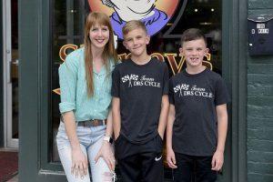 Owen with his brother and the owner of Shirley's Gourmet Popcorns