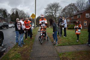 Lucy Brooks getting her surprise bike with support from Philadelphia Flyers Alumni