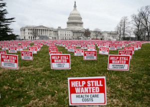 Stock Help Still Wanted signs protesting health care and child care costs at the capital.