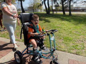 Carl Pelo sitting on his adaptive bike