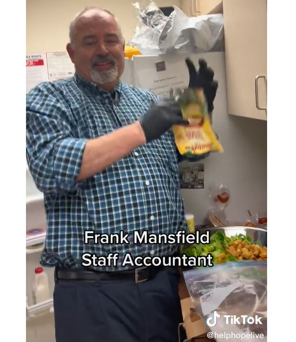 A TikTok screenshot shows Frank Mansfield from the Finance department holding a bag of croutons and smiling