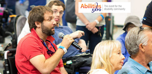 A graphic shows a man with light skin in a red short-sleeved polo shirt holding the microphone with an individual in a wheelchair listening behind him. A graphic reads Abilities Expo the event for the disability community.