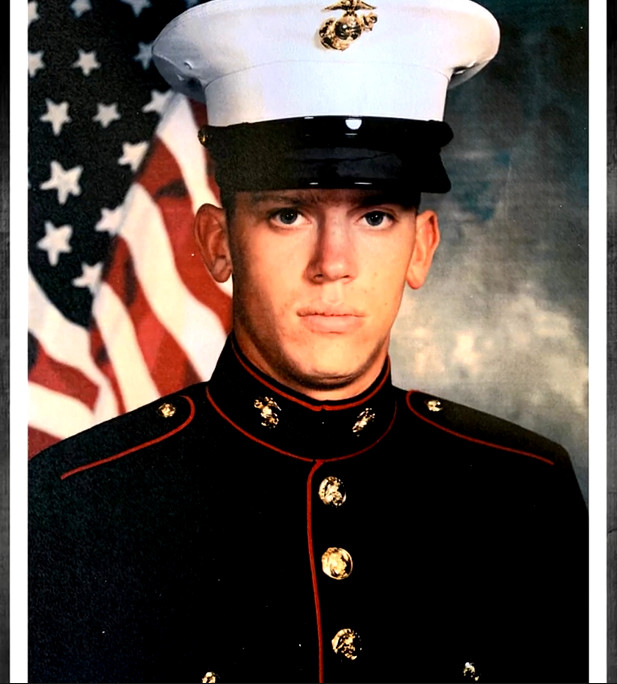 Bill Soloway's heart donor is pictured in his Marine uniform with a serious expression, light skin, and striking blue eyes.