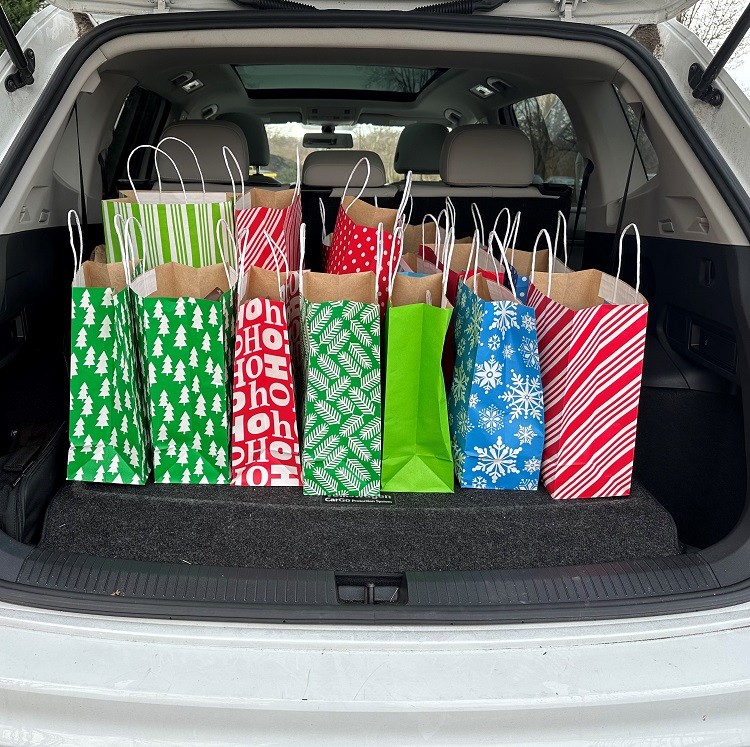 Colorful Bags of Hope bags are in the trunk of a car.