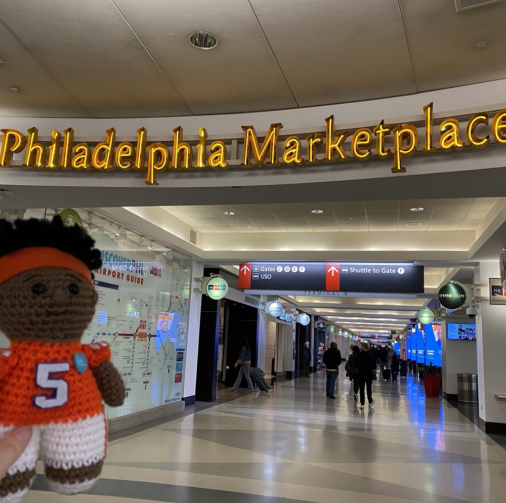 A knit Lil KJ Henry doll at Philadelphia Airport