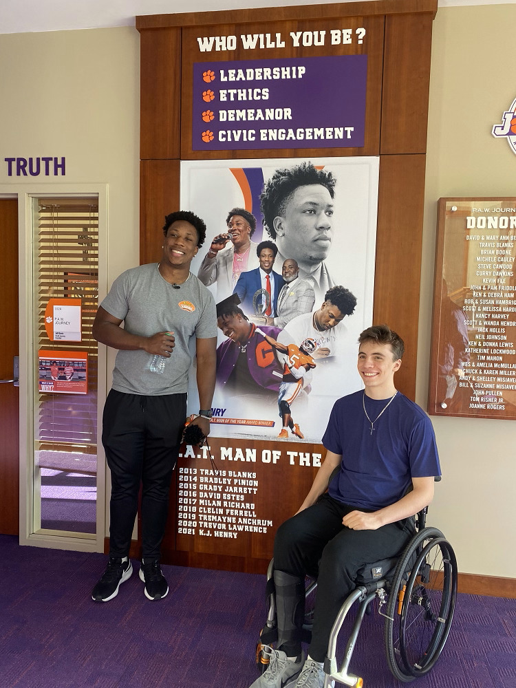 KJ Henry meets with a Help Hope Live support recipient