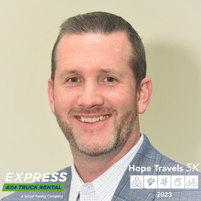 Ken from Express 4x4 has light skin, brown eyes, and short gray hair in this portrait. In the corners of the picture are logos for Express 4x4 Truck Rentals: A Sasser Company and the Hope Travels 5K.