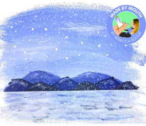 Rebecca Koltun's mouth-painted holiday card cover features visible brush strokes on a blue, white, and silver snowy mountain scene with black and blue mountains visible in the distance. A graphic at the upper right reads Made by Mouth by Rebecca Koltun with a digital image of Rebecca mouth-painting.