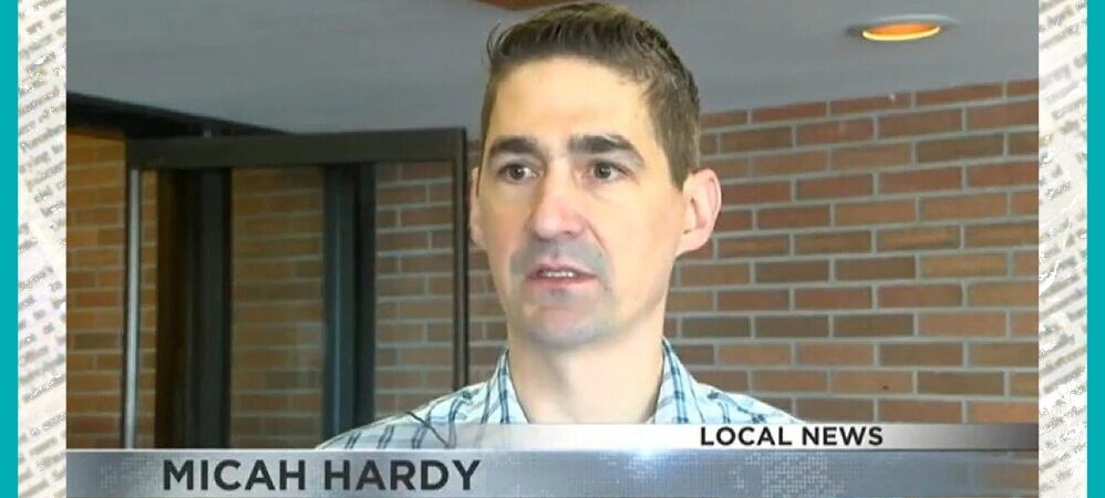 Client Micah Hardy is pictured in a news broadcast screenshot with a ticker that reads Local News: Micah Hardy, double-lung transplant recipient. He has light skin, short dark hair, a faint goatee, and a striped blue shirt.