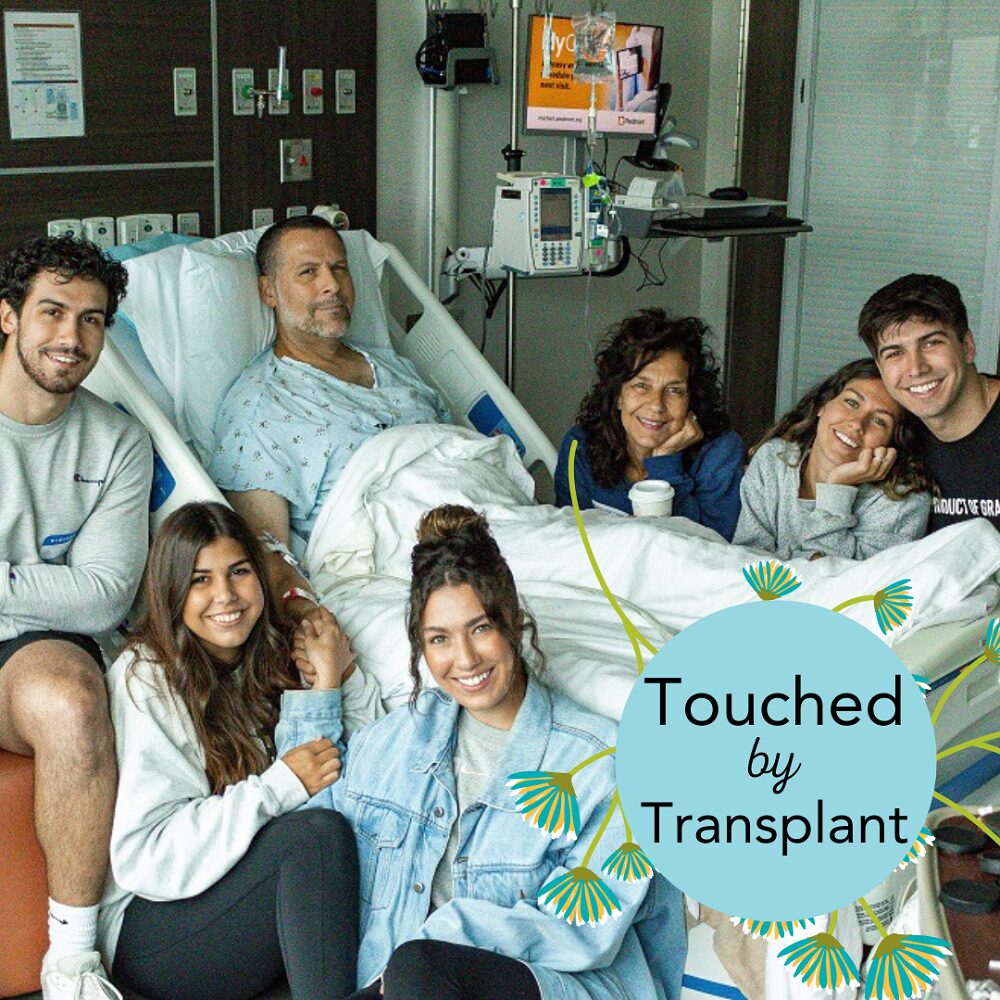 Heart transplant recipient John A Lee in a hospital bed surrounded by his wife and five adult children. John has light skin, short dark hair, and a short gray beard. An overlay graphic reads Touched by Transplant with flowering green vines.