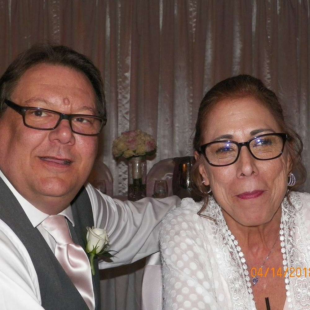 Ken Miller in a photo with his wife at a formal event. The photo is marked April 14 2011.