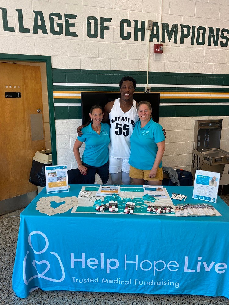 Washington Commanders player KJ Henry with Kelly L Green and Sonny Mullen from Help Hope Live.