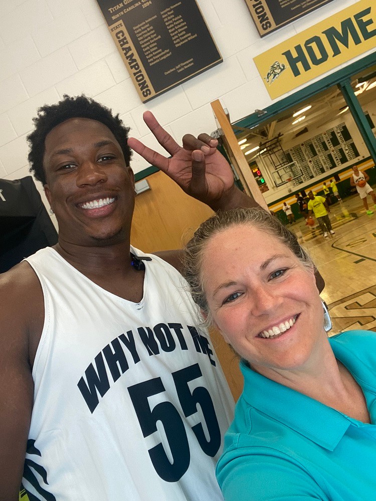 Selfie with Washington Commanders KJ Henry and Help Hope Live's Sonny Mullen. KJ's basketball jersey says 55 Why Not Me.