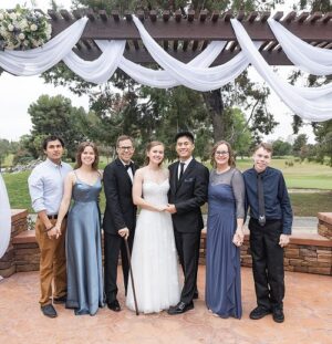 Philip Brady in a suit with a black cane at a wedding.