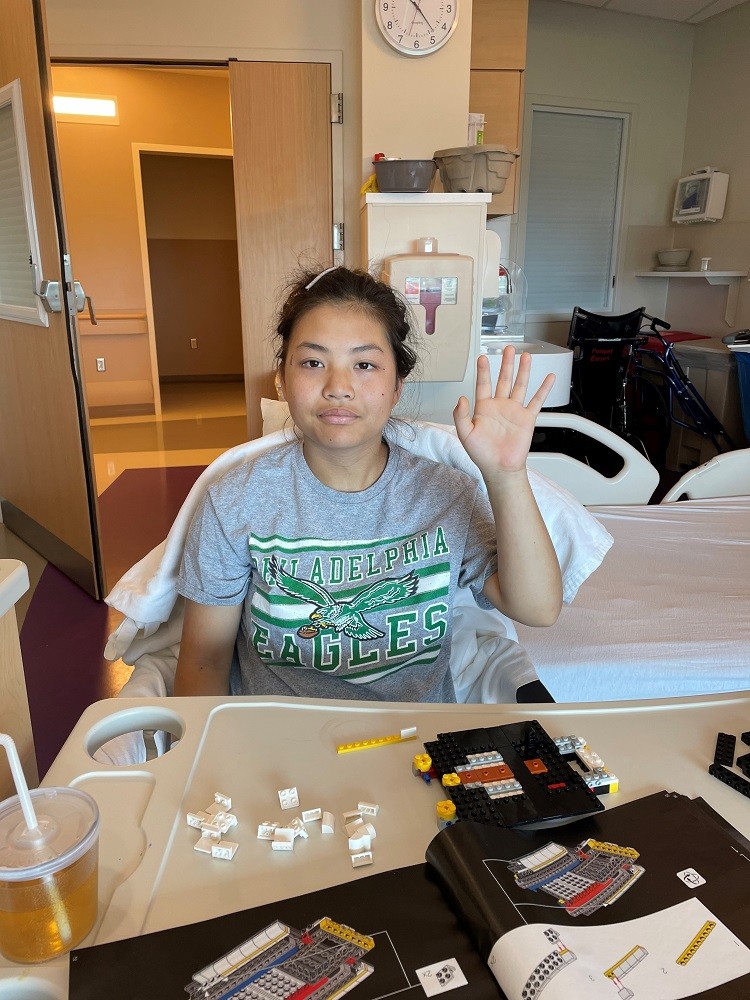 16-year-old Jinju in the hospital with an Eagles shirt.