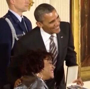 Janice Jackson receives a medal from President Barrack Obama.