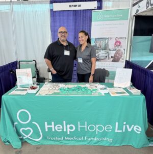 Help Hope Live's Kelly L Green and ambassador Kevin Lopez at the Help Hope Live booth of Abilities Expo Dallas 2024.