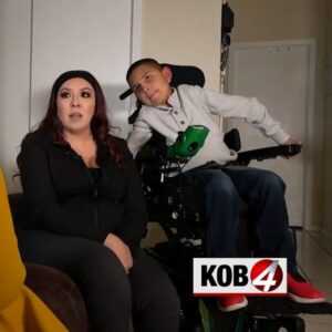 10-year-old Luis Aguilar in his power chair with mom Mariah on a KOB 4 interview.