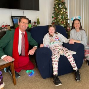 Ashley Nicole Keen with her older sister Tiffany Curtis at Christmas with CBS 8's Jeff Zevely.