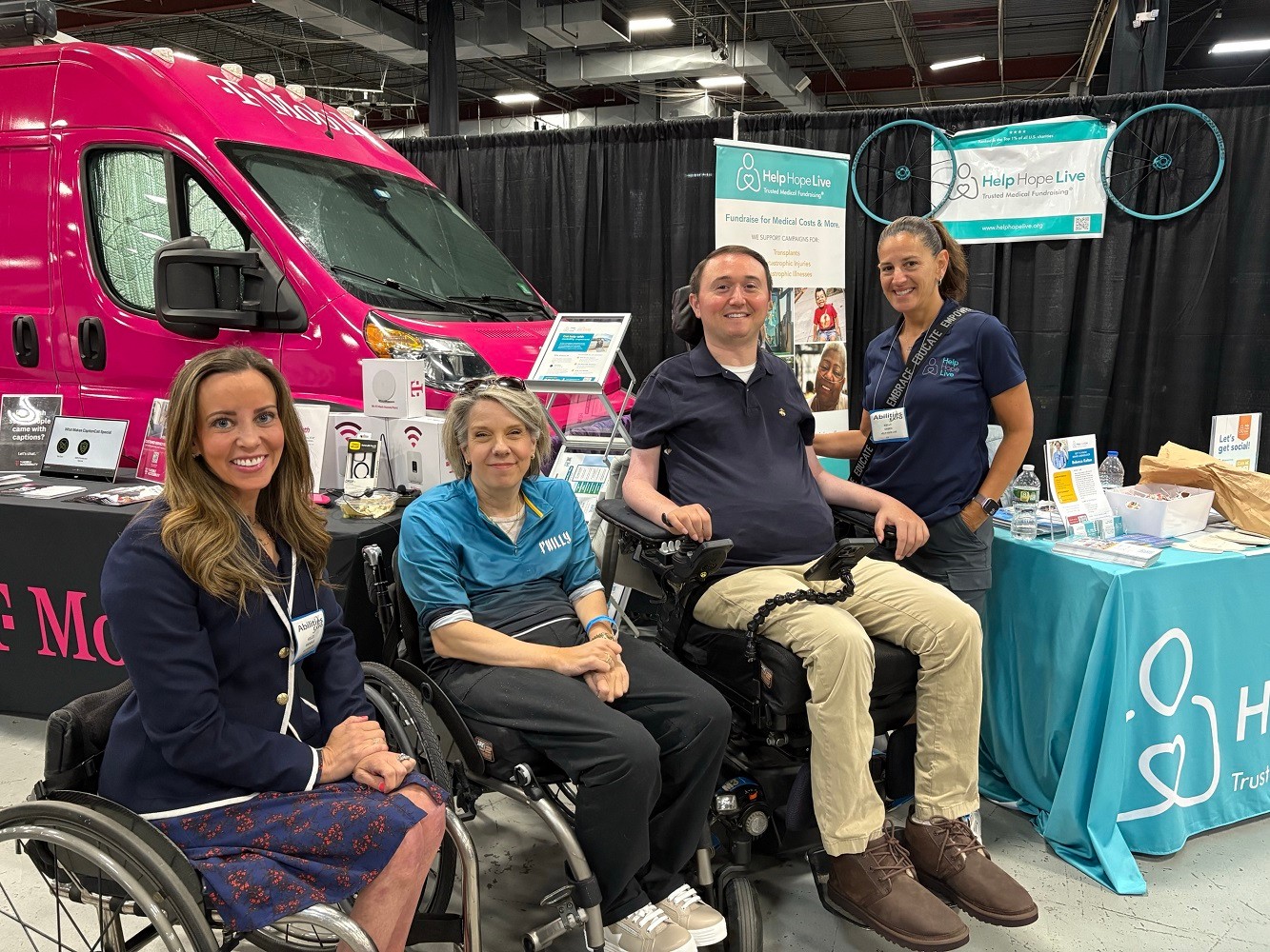 Kelley Brooks Simoneaux Esq. with Lauren DeBruicker and Josh Basile Esq. all seated in wheelchairs at Abilities Expo NY Metro 2025 with Kelly L Green.