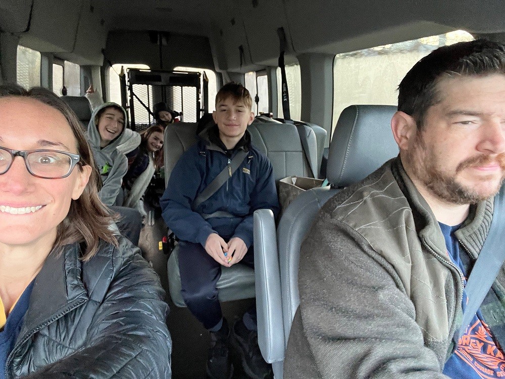 6-year-old Sylvan DeSocio in the back of an adaptive van with three siblings and his parents.