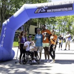 At Hope Travels 5K 2025, participants from Magee Rehab with KJ Henry and Help Hope Live's Shannon Shensky.