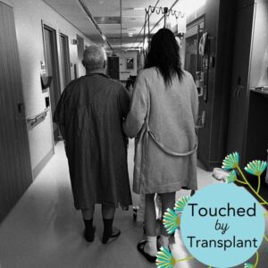A black and white photo of Tim Fuller and his daughter Tanis in the hospital after Tanis donated a kidney to Tim in April 2025. Text reads Touched by Transplant.