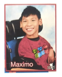 12-year-old Maximo Peng or Max seated in his wheelchair.