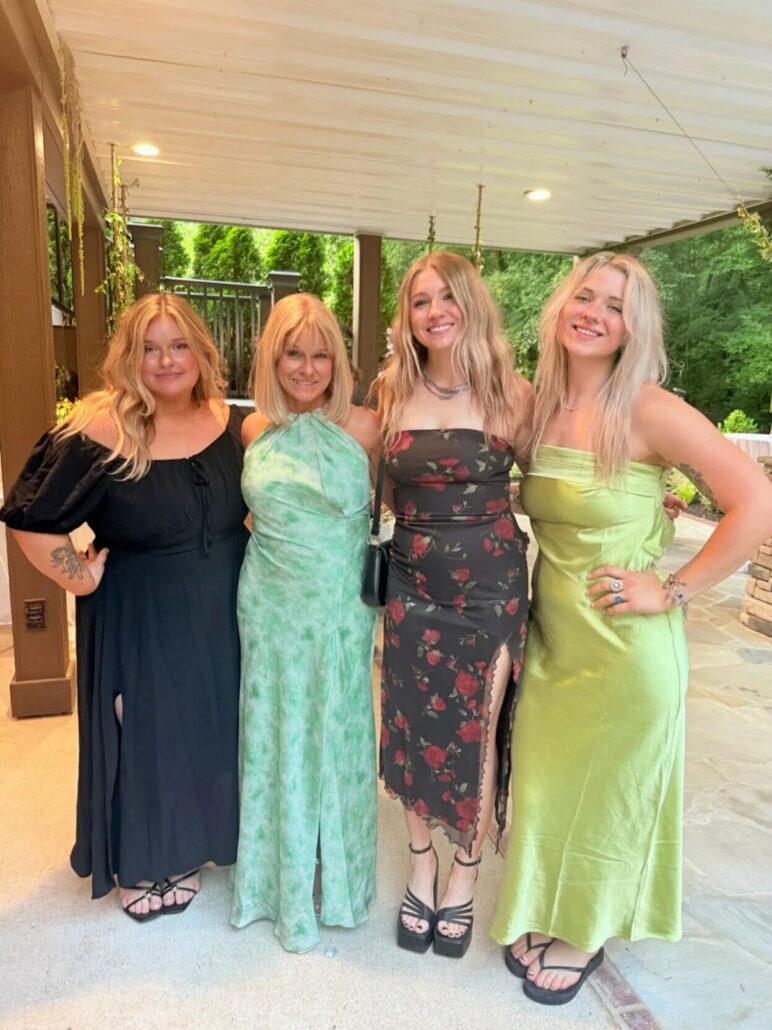 Pamela Lamb with 3 other blonde women in formal attire.