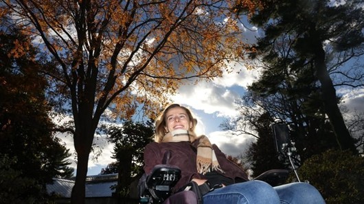Rebecca Koltun outside in the fall in her power chair via Newsday December 2025.