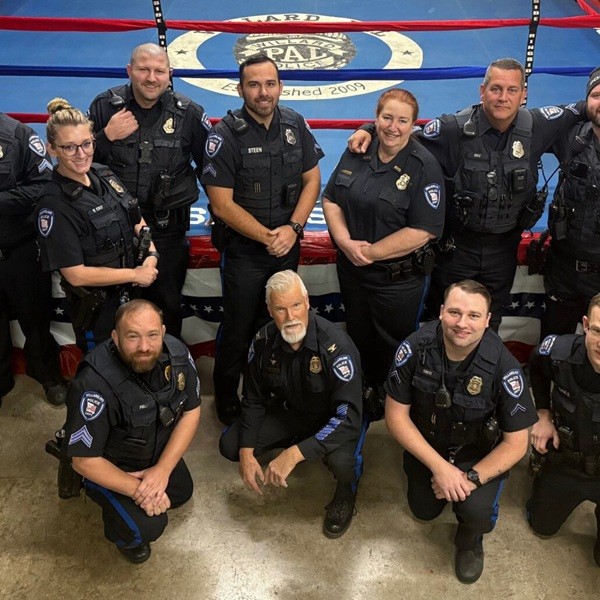 Thomas McClain in his police attire with his squad.